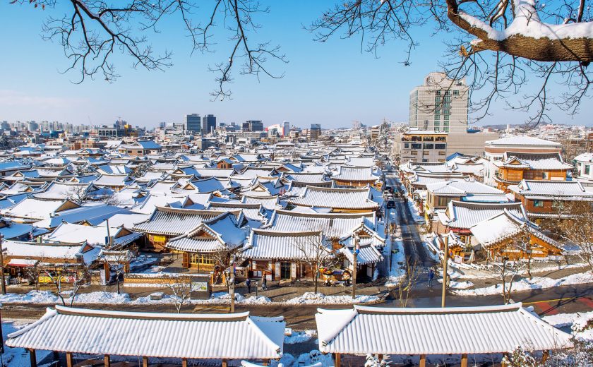 Roof of Jeonju traditional Korean village covered with snow, Jeo